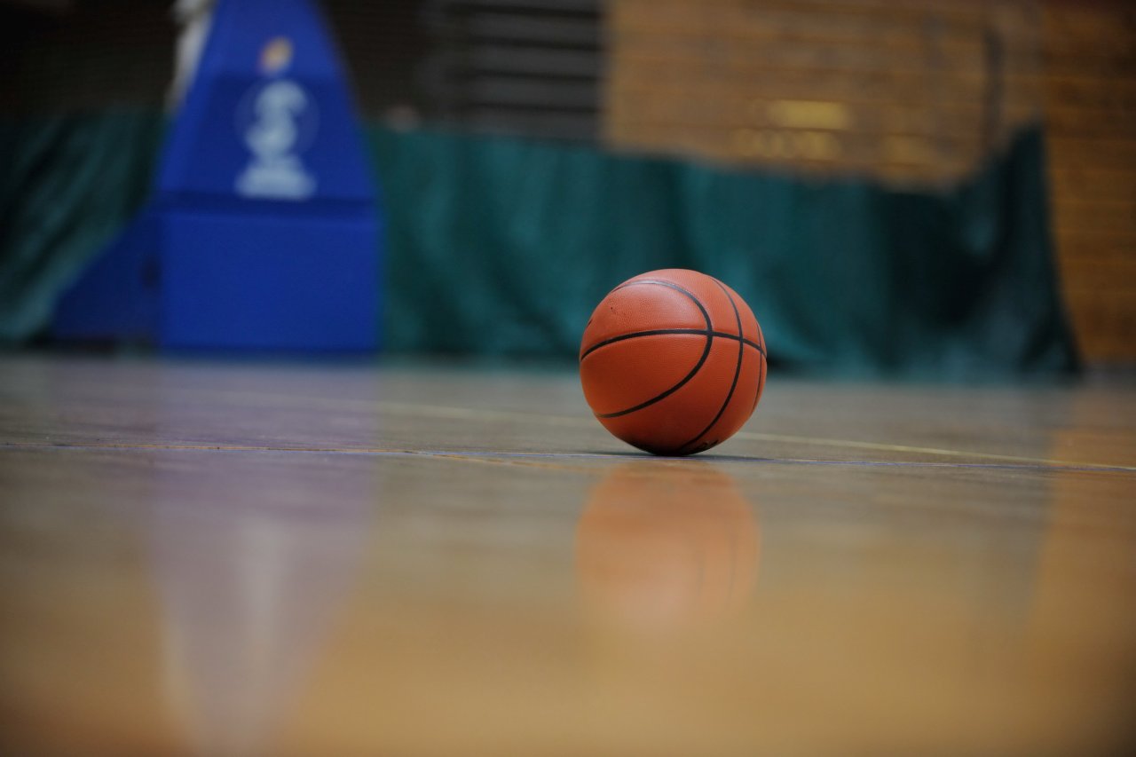 basketball ball and net on black background